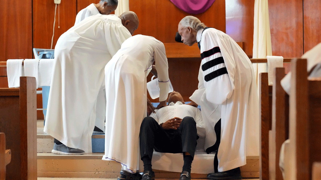 New York City's mayor gets baptized in jail by Rev. Al Sharpton on Good Friday