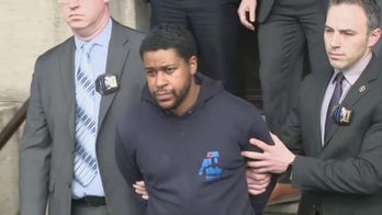 Perp walk: New Yorkers shout at suspect in fatal shooting of NYPD police officer, who now faces charges